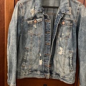 Women’s large distressed denim jacket